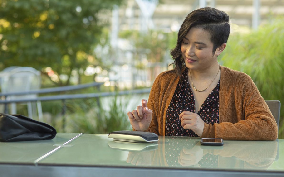 Poly HP Sync 20 Lifestyle Image Woman Outdoors Print RGB 1 1